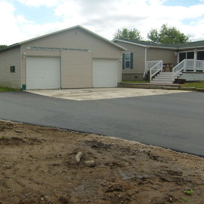 new driveway with asphalt paving