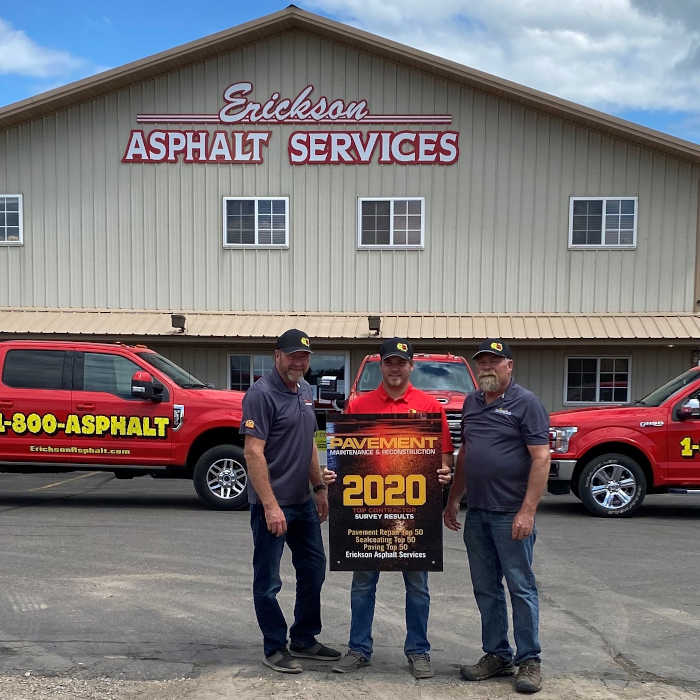 Owners of Erickson Asphalt showing off new award
