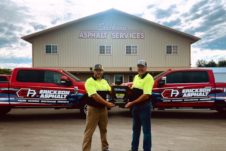 Owners of Erickson Asphalt showing off new award