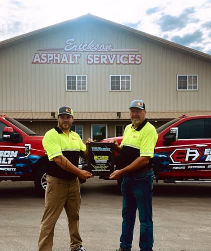 Owners of Erickson Asphalt showing off new award