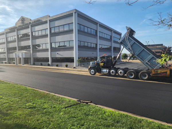 Asphalt paving the parking lot at Evangelical Free Church of America