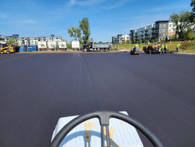 final lift of hot asphalt being installed