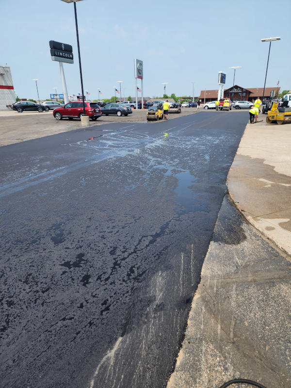 Final asphalt paving drive lane.