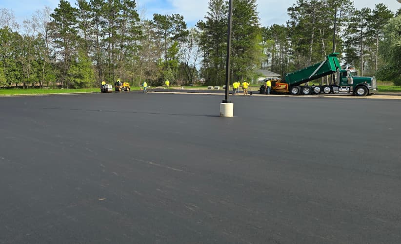 3' of asphalt being laid on parking lot.