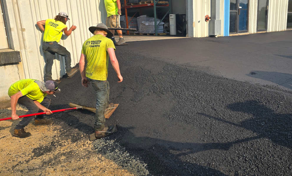 Hand work being done on loading dock ramps.