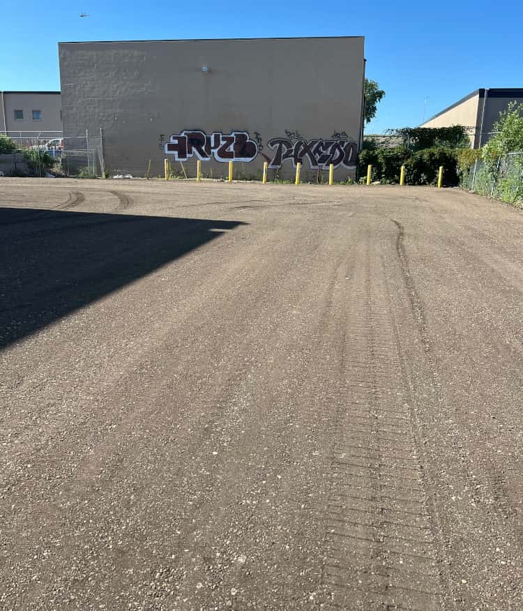 Base for asphalt being compacted and ready for paving