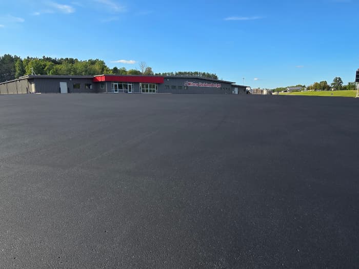 Final sealcoating on  Milaca Unclaimed Freight's parking lot. 