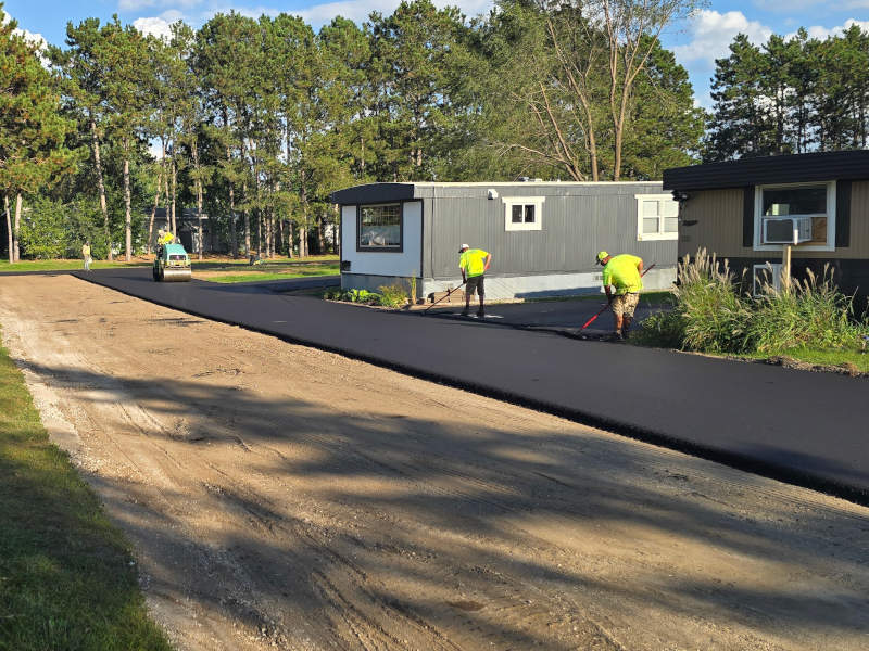 Asphalt crew working on roadway 