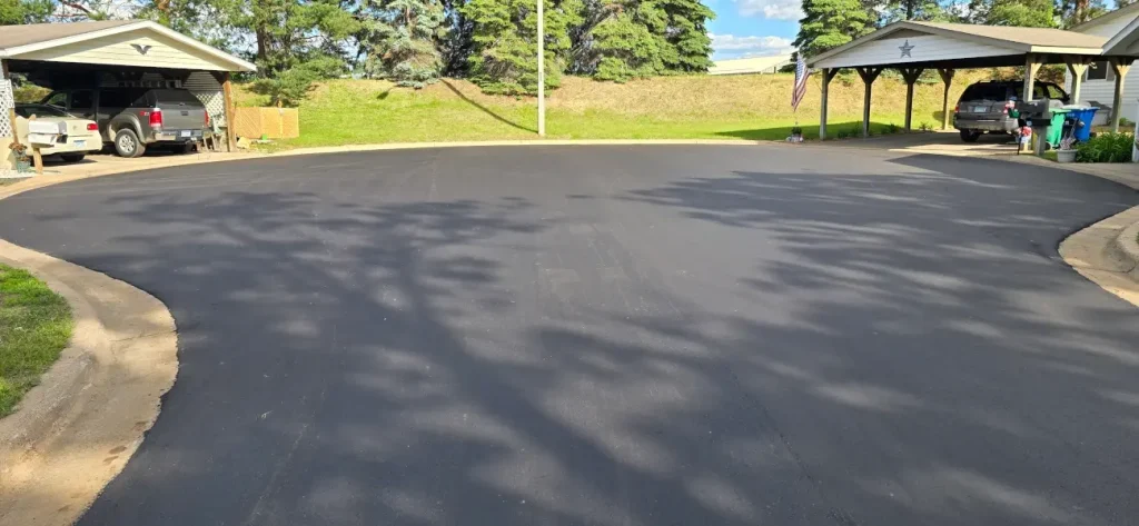 Cul-de-sac in Pine Village with new asphalt.