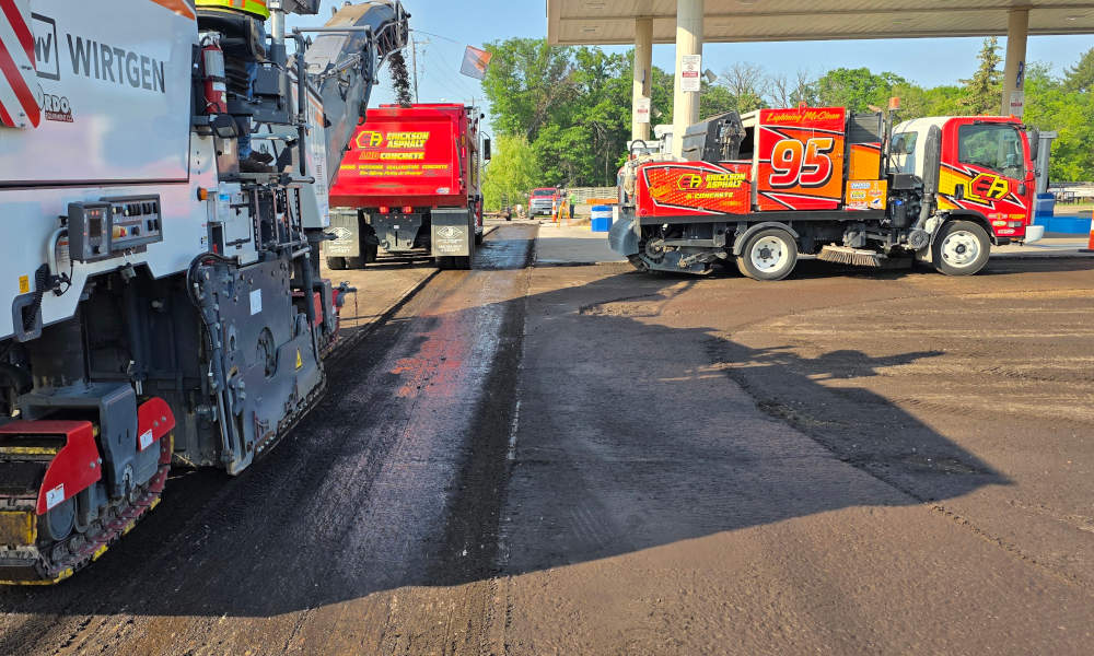 Sweeper removing asphalt millings
