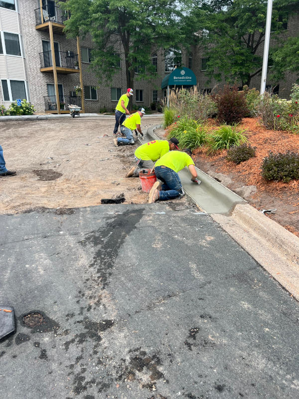 crew installing concrete curbs
