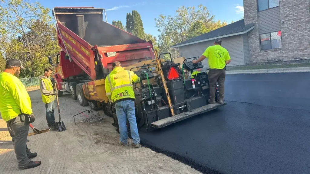 first lift of asphalt being laid