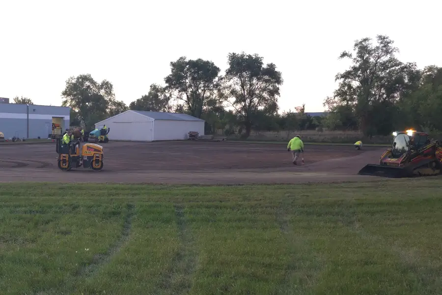 Base material being compacted