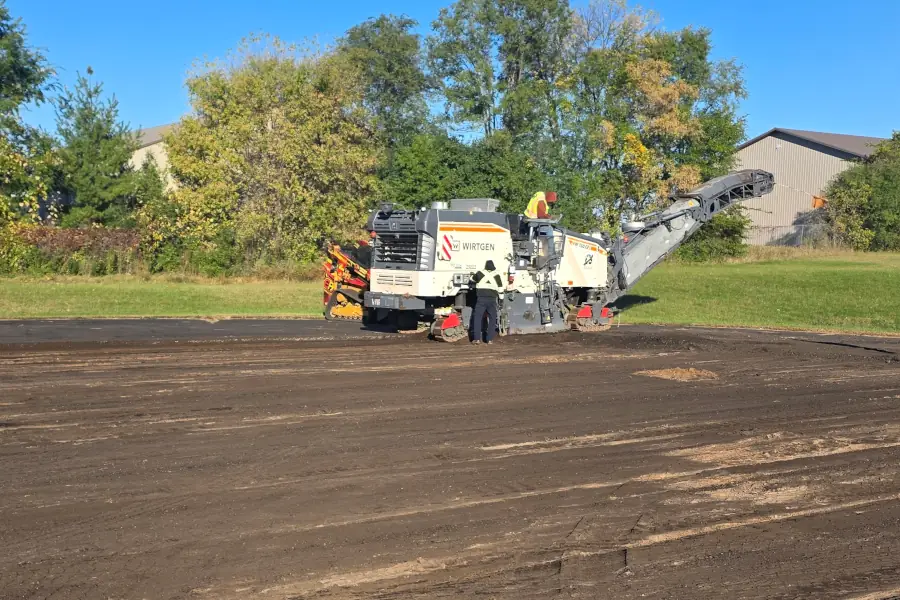Asphalt parking lot being milled